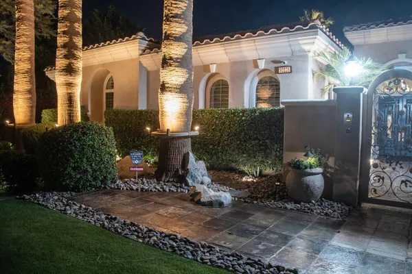 a living room with fireplace furniture and a large window