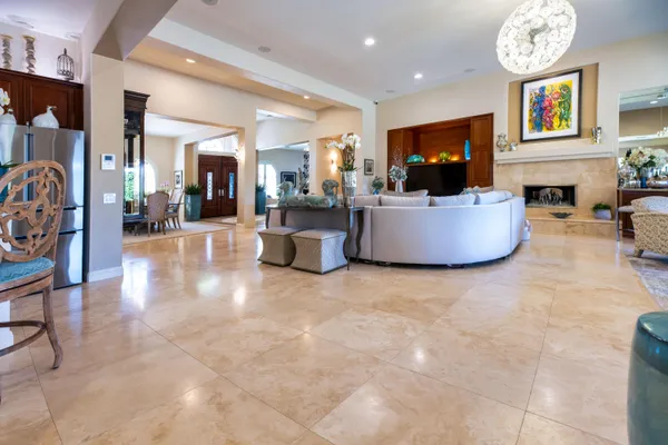 a spacious bedroom with a bed and a flat screen tv