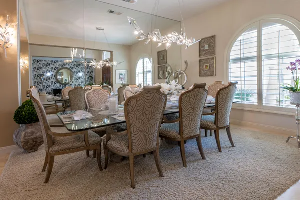 a spacious bathroom with a tub sink shower and mirror