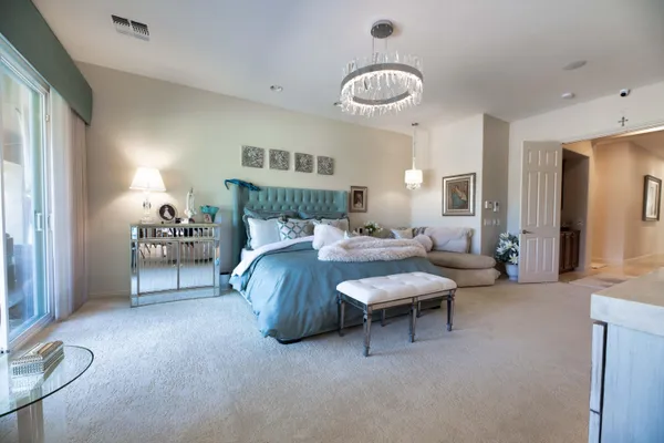a kitchen with granite countertop wooden cabinets stainless steel appliances and a large window