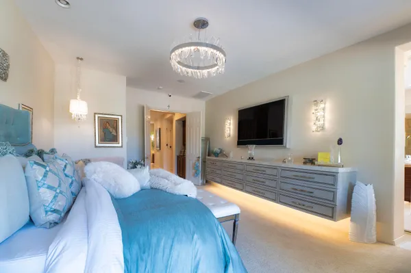 a patio with a table and chairs under an umbrella