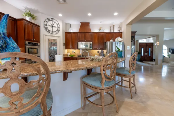 a view of a backyard with sitting area and furniture