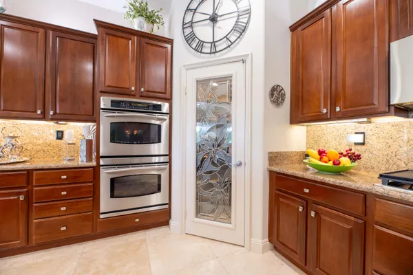 a view of a house with backyard porch and sitting area