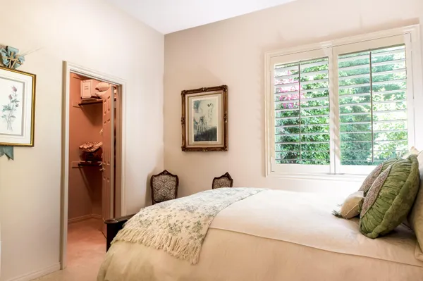 a view of a dining room with hardwood floor and chandelier