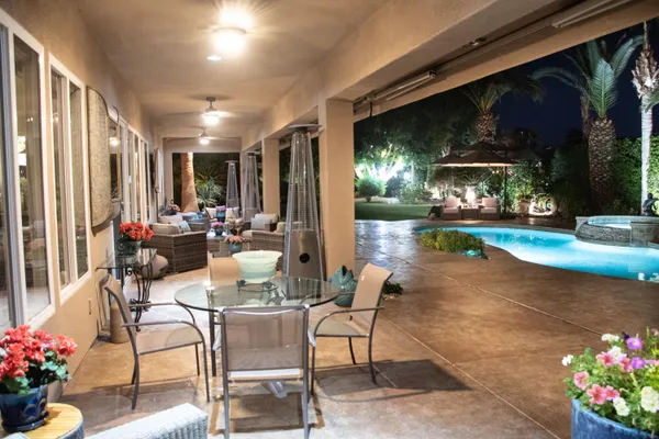 a view of a swimming pool with a patio