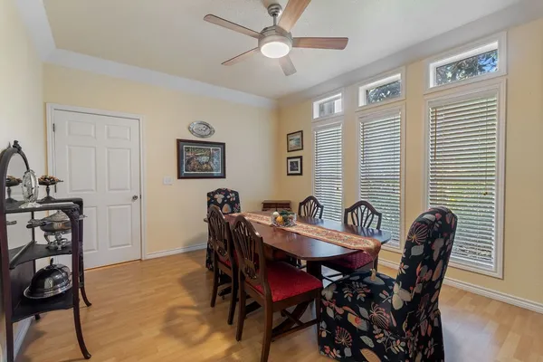 a view of a dining room with furniture and wooden floor