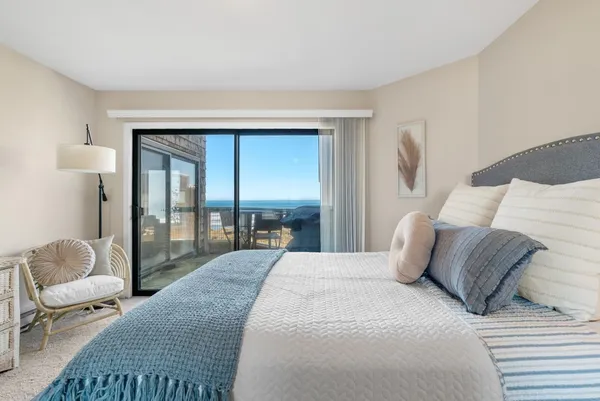 a balcony with table and chairs