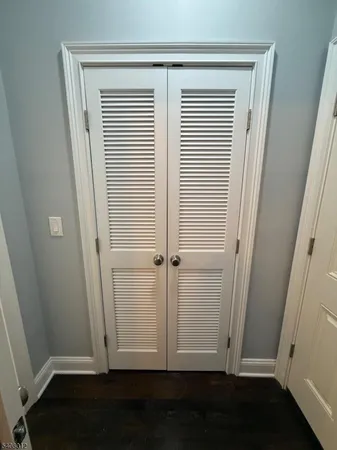 an empty room with wooden floor