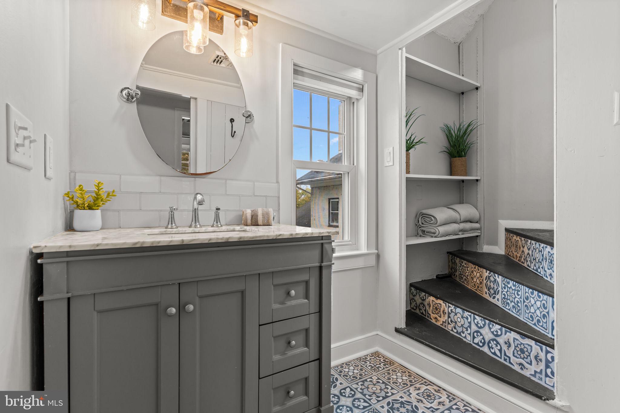 2565 Bogarts Tavern Road Doylestown, PA 18902 - Photo 16 of 31 a bathroom with a sink and a mirror