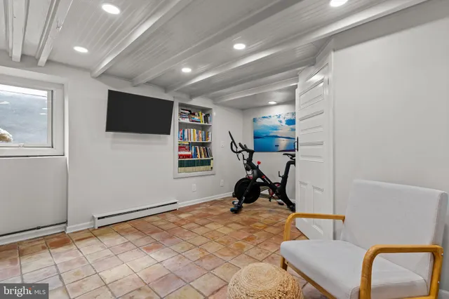 a view of a room with workspace and mirror