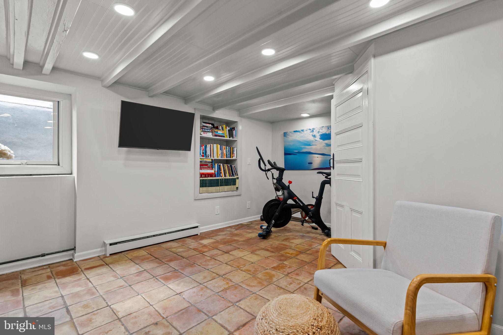 2565 Bogarts Tavern Road Doylestown, PA 18902 - Photo 18 of 31 a view of a room with workspace and mirror