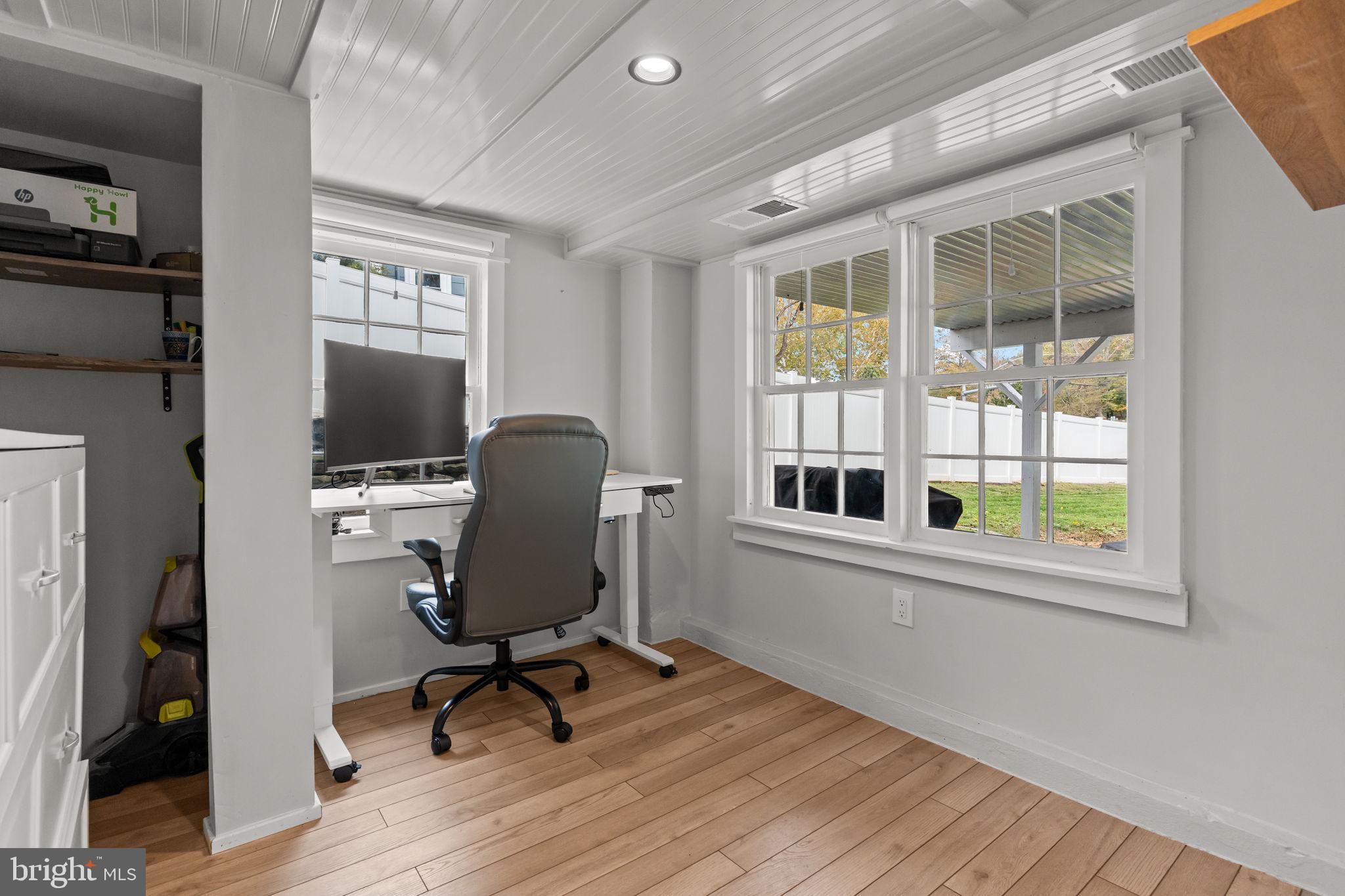2565 Bogarts Tavern Road Doylestown, PA 18902 - Photo 22 of 31 a view of a workspace with furniture and a window