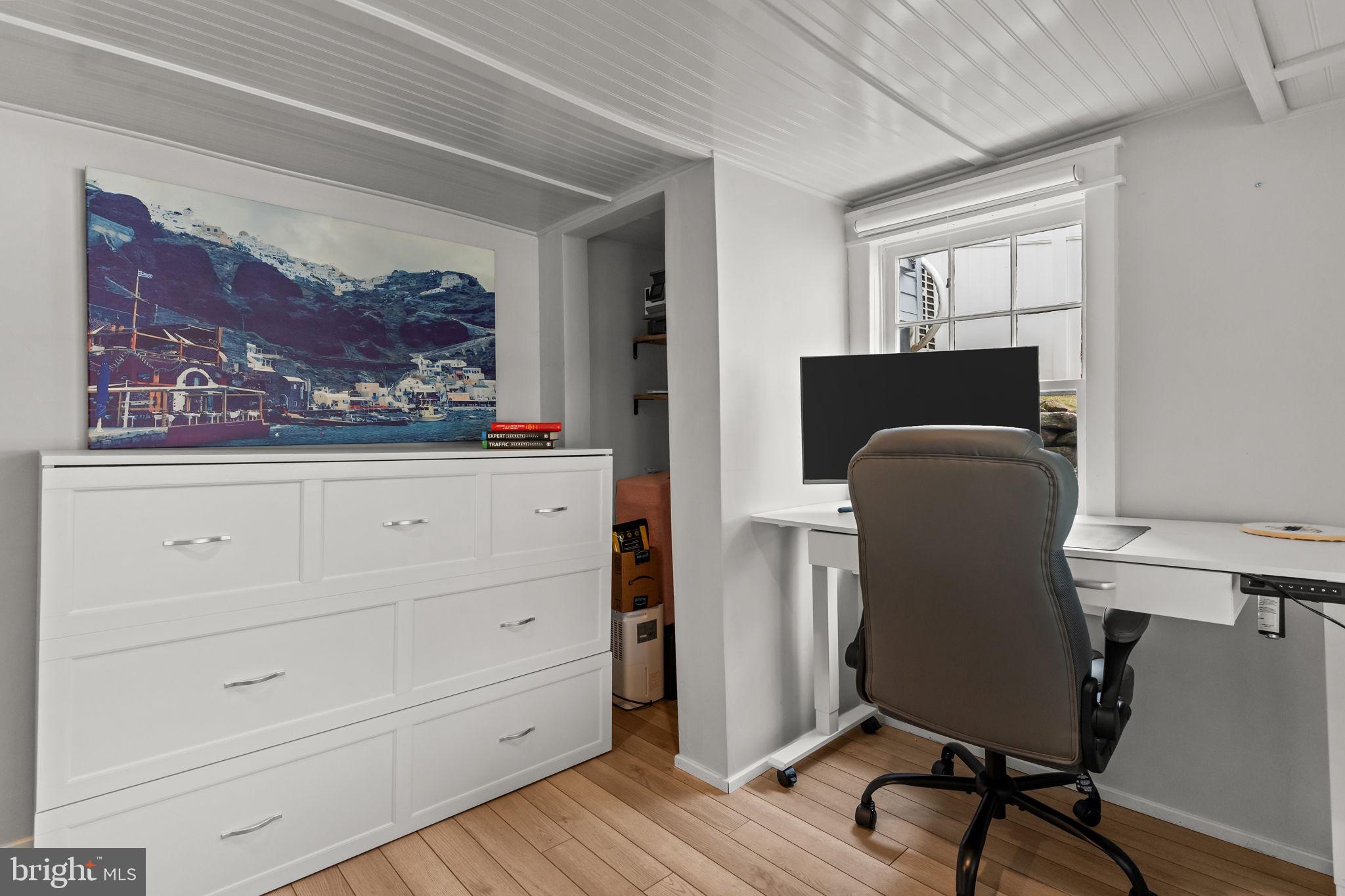 2565 Bogarts Tavern Road Doylestown, PA 18902 - Photo 23 of 31 a view of a workspace with furniture and a window