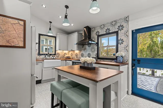 a kitchen with sink cabinets and window