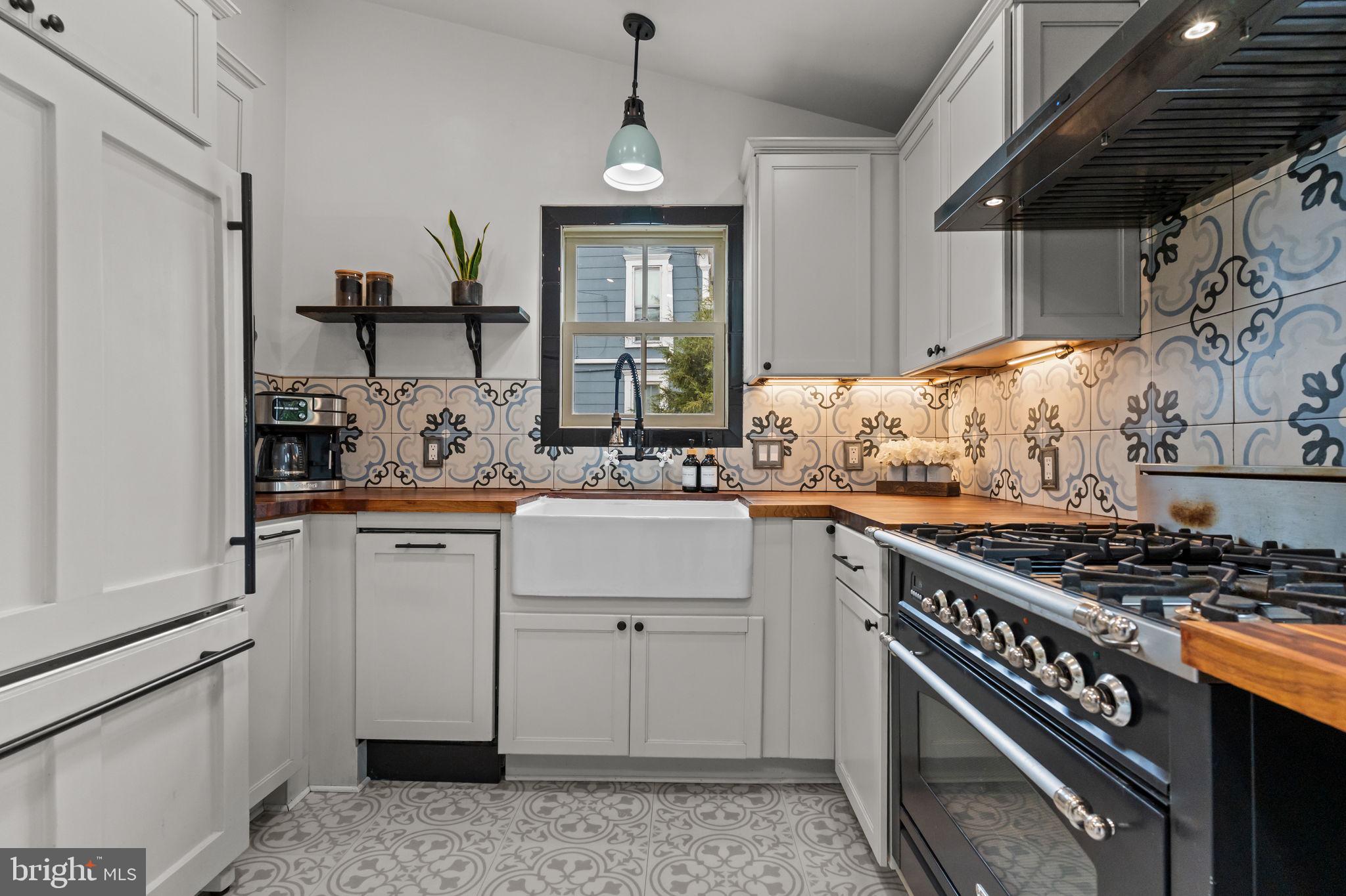2565 Bogarts Tavern Road Doylestown, PA 18902 - Photo 6 of 31 a kitchen with white cabinets and appliances