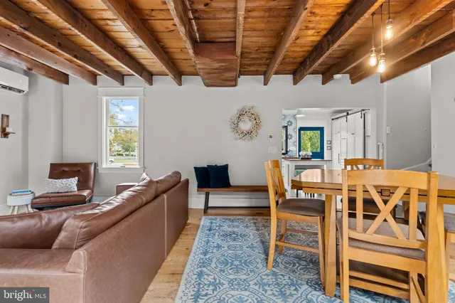 a dining room with furniture and window