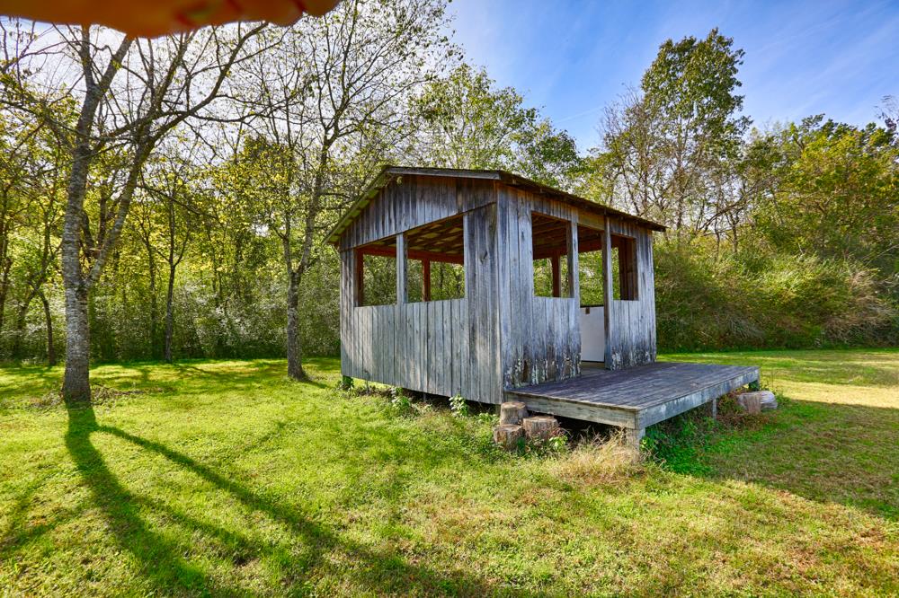 28861 Veto Road Elkmont, AL 35620 - Photo 20 of 29 a view of backyard with wooden fence