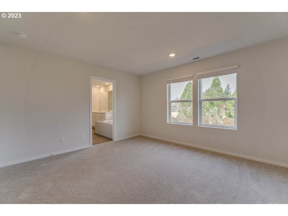2642 26th Loop Springfield, OR 97477 - Photo 14 of 23 a view of an empty room with a window