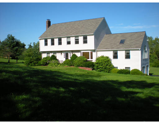 73 Heywood Road Sterling, MA 01564 - Photo 1 of 14 a front view of a house with a yard