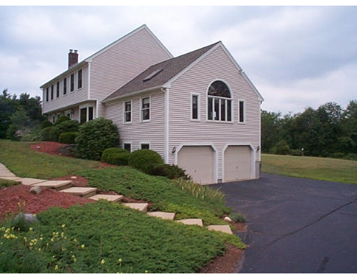 73 Heywood Road Sterling, MA 01564 - Photo 2 of 14 a front view of a house with a yard