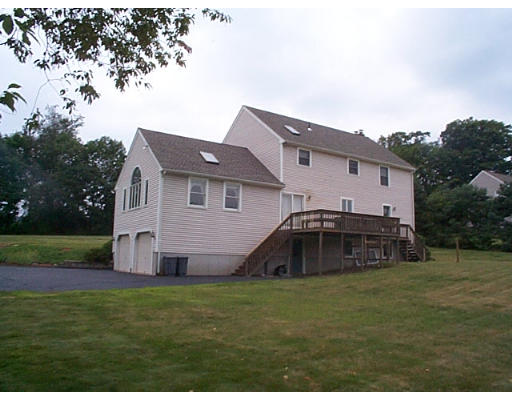 73 Heywood Road Sterling, MA 01564 - Photo 3 of 14 a front view of a house with garden