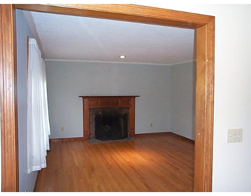 73 Heywood Road Sterling, MA 01564 - Photo 4 of 14 a view of an empty room with wooden floor and a window