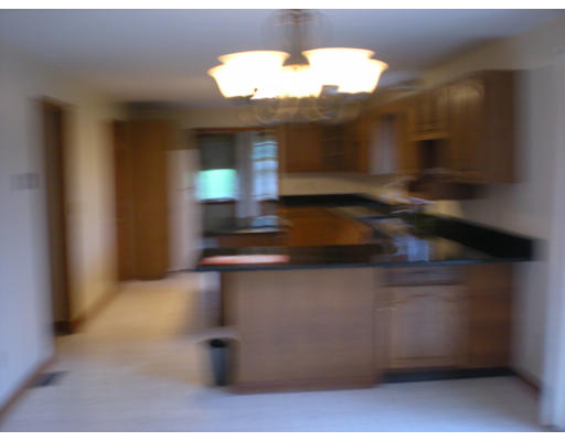 73 Heywood Road Sterling, MA 01564 - Photo 7 of 14 a kitchen with a stove and cabinets