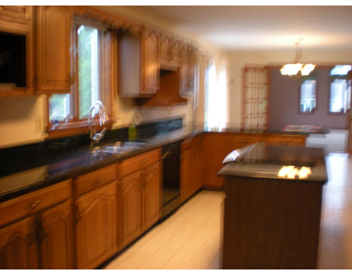 73 Heywood Road Sterling, MA 01564 - Photo 8 of 14 a kitchen with stainless steel appliances a sink and cabinets