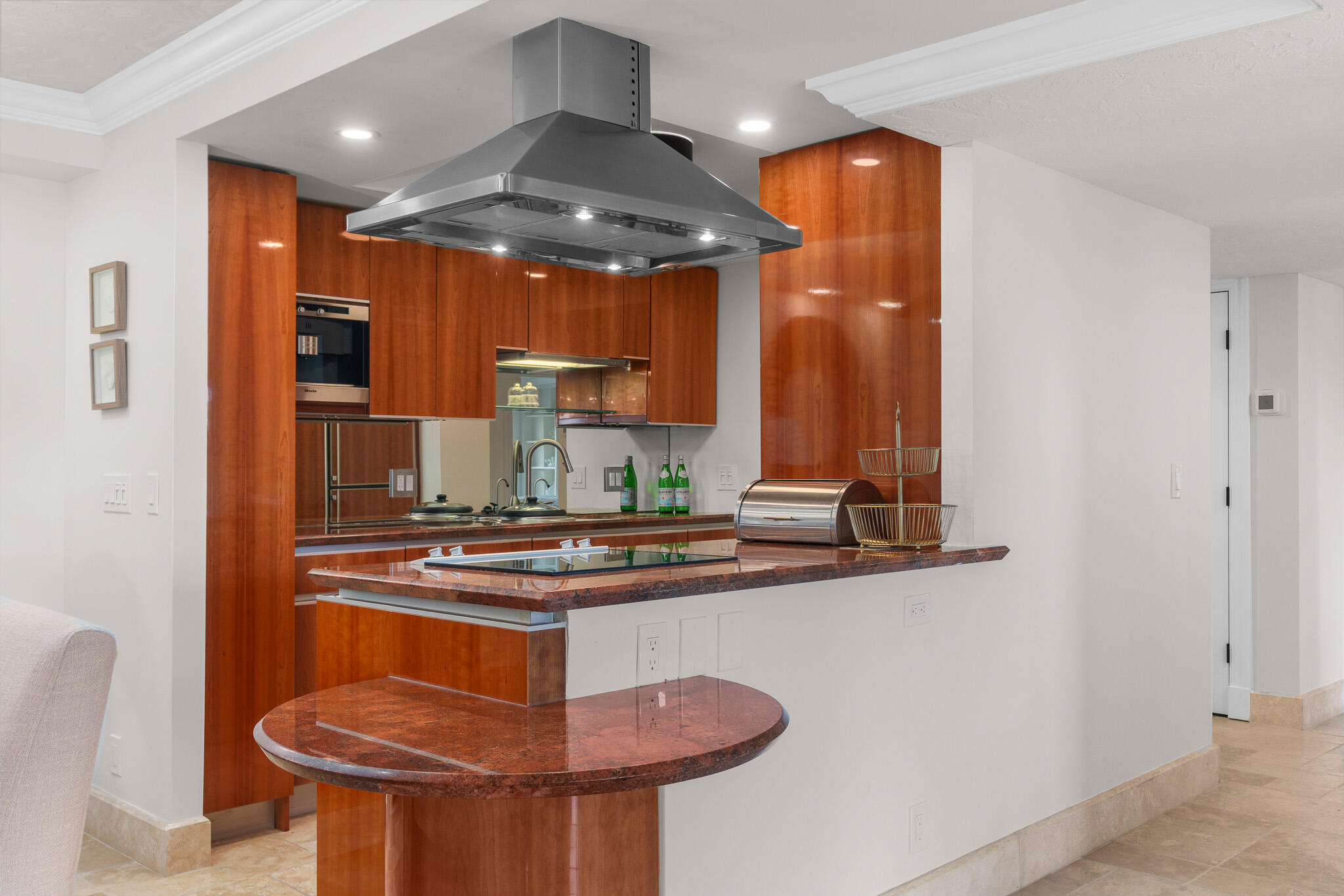 1111 South Ocean Boulevard, Unit 417 Boca Raton, FL 33432 - Photo 11 of 47 a kitchen with stainless steel appliances granite countertop a sink a stove and a refrigerator