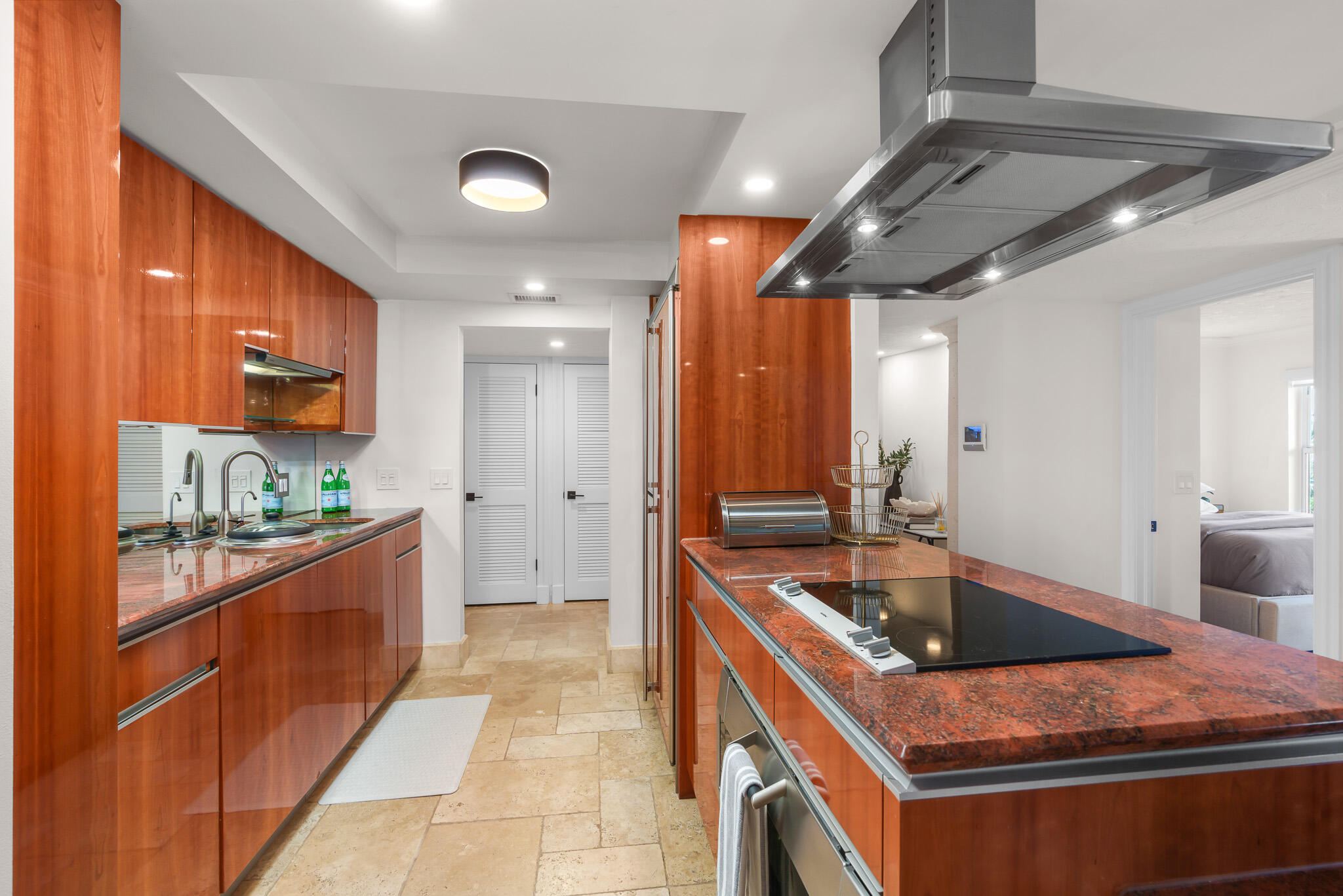 1111 South Ocean Boulevard, Unit 417 Boca Raton, FL 33432 - Photo 13 of 47 a kitchen that has a sink and a stove