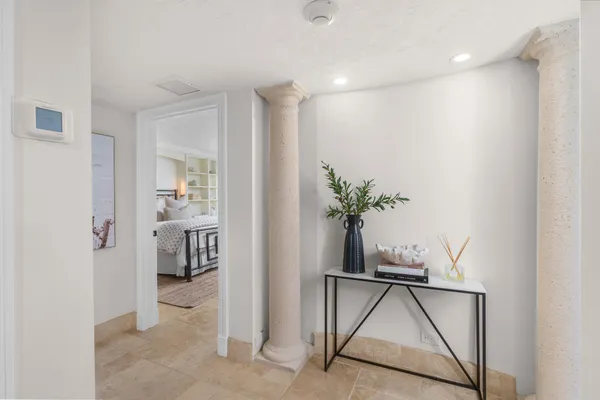 a view of a hallway and interior of the house