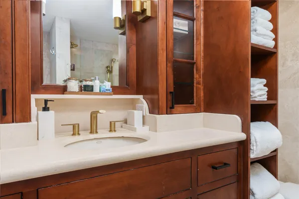 a bathroom with a sink and a mirror