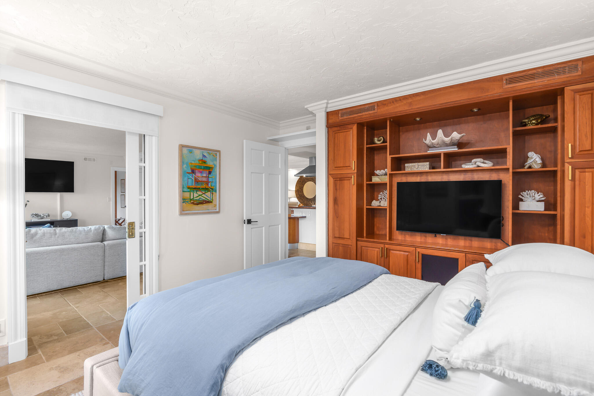 1111 South Ocean Boulevard, Unit 417 Boca Raton, FL 33432 - Photo 30 of 47 a bedroom with a bed and a flat screen tv
