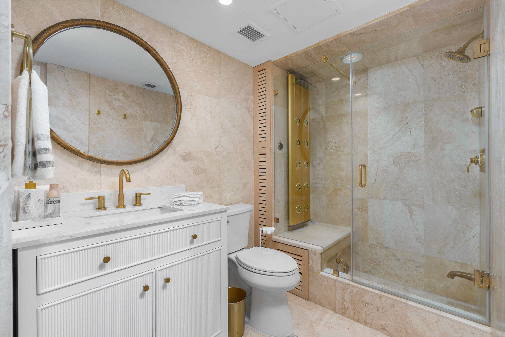 1111 South Ocean Boulevard, Unit 417 Boca Raton, FL 33432 - Photo 35 of 47 a bathroom with a toilet sink vanity granite and shower