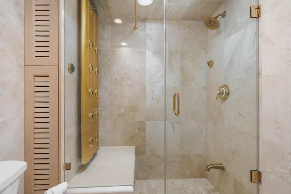 a bathroom with a shower and a sink