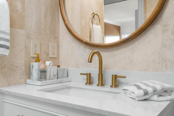 a bathroom with a mirror and a sink