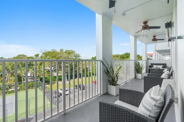 a view of a balcony with furniture