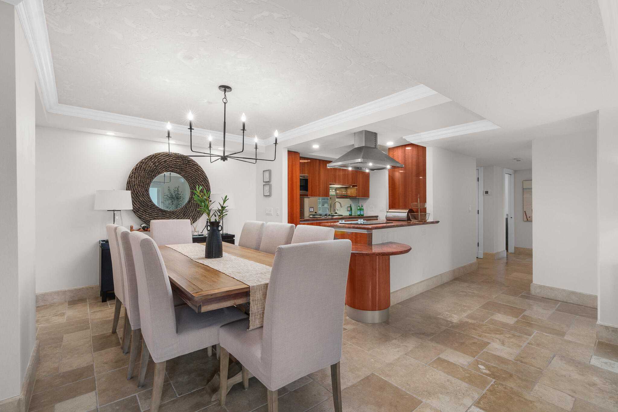 1111 South Ocean Boulevard, Unit 417 Boca Raton, FL 33432 - Photo 8 of 47 a view of a dining room with furniture and chandelier