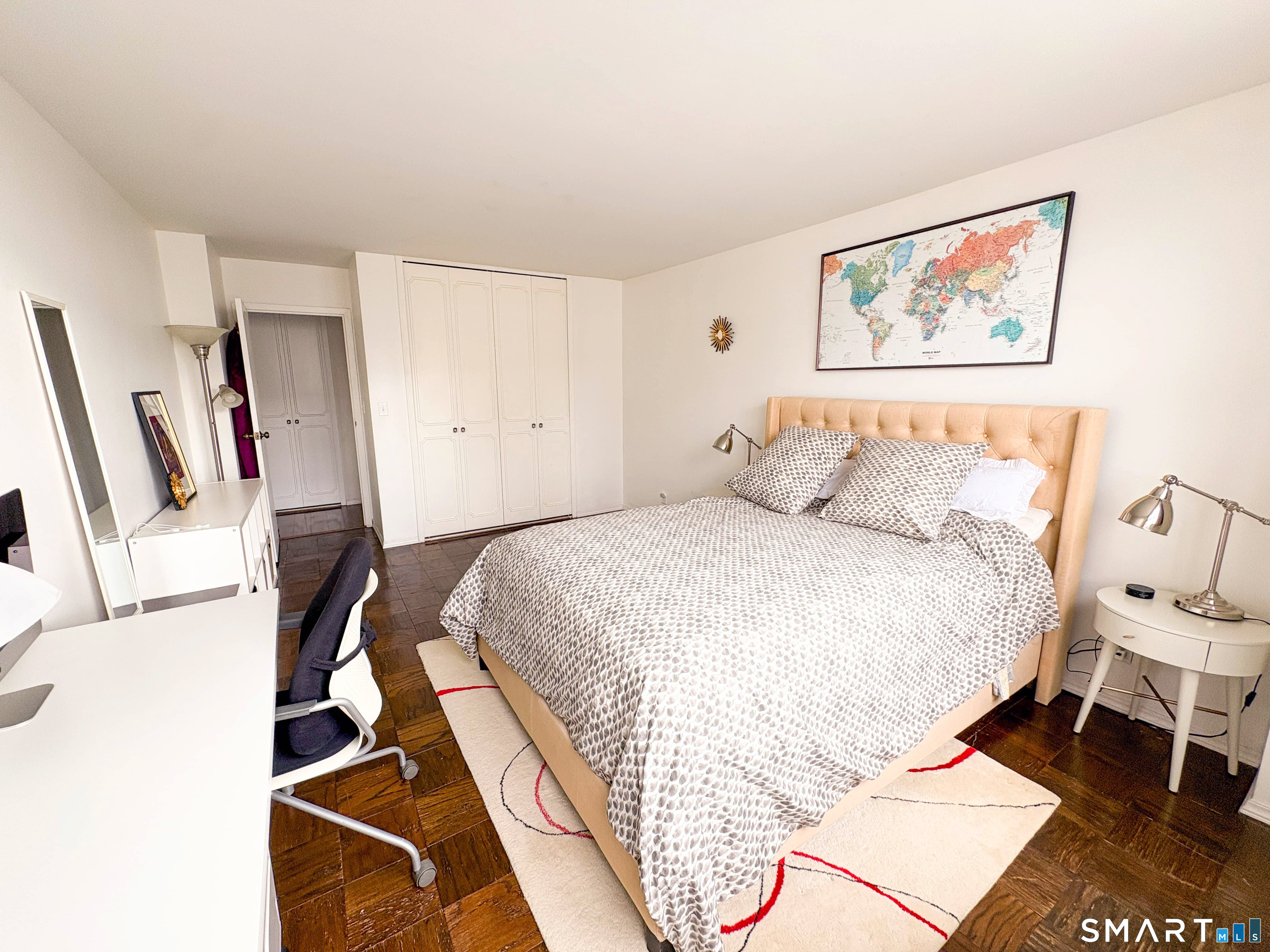 50 Glenbrook Road, Unit 9C Stamford, CT 06902 - Photo 7 of 20 a bedroom with a bed and a painting on the wall