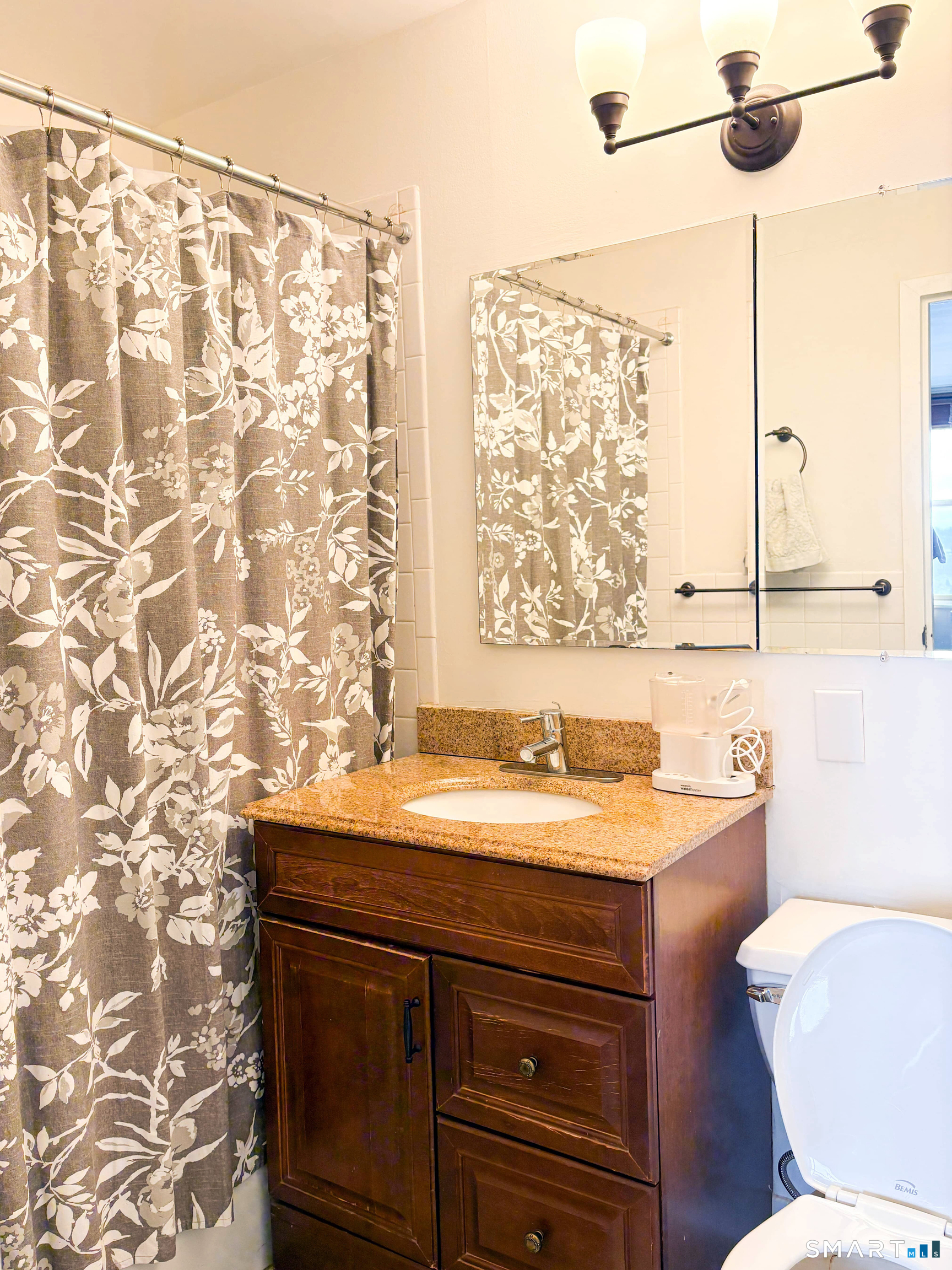 50 Glenbrook Road, Unit 9C Stamford, CT 06902 - Photo 10 of 20 a bathroom with a sink and a toilet