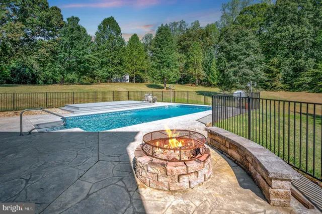 a view of a swimming pool with a backyard