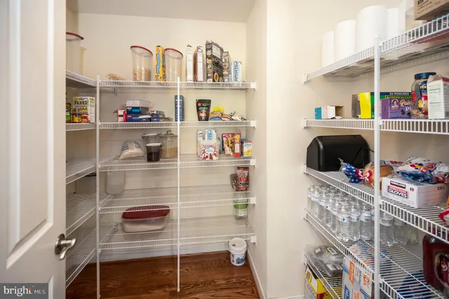 a view of entryway with wooden floor and stairs