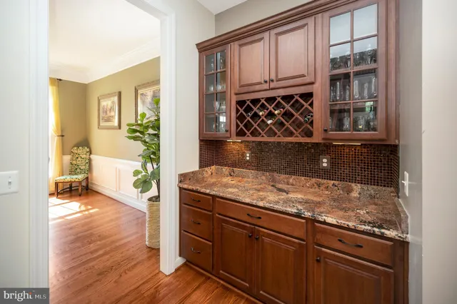 a view of a room with a window and a ceiling fan