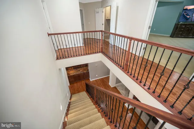 a spacious bathroom with a tub a sink and mirror