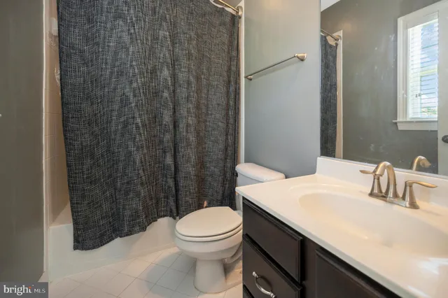 a living room with furniture pool table and a table