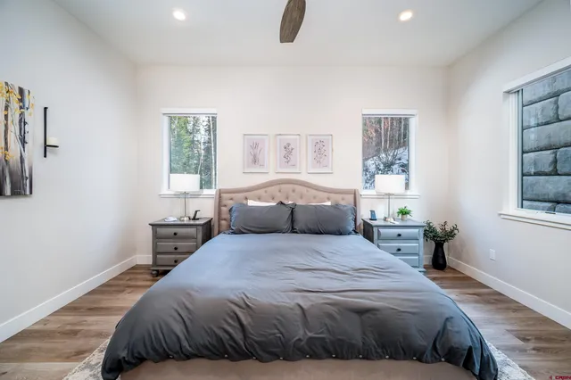 a bedroom with a large bed and a window