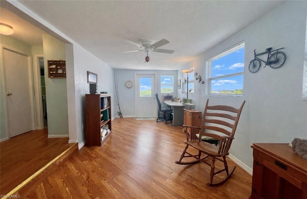 273 Cape Sable Drive Naples, FL 34104 - Photo 20 of 49 a work room with furniture and wooden floor