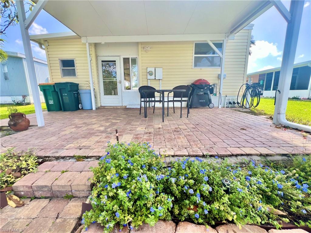 273 Cape Sable Drive Naples, FL 34104 - Photo 2 of 49 a view of a backyard with plants and patio