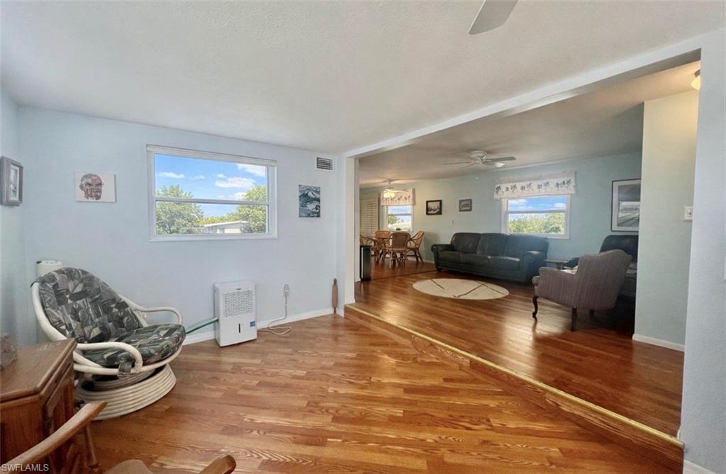 273 Cape Sable Drive Naples, FL 34104 - Photo 21 of 49 a living room with furniture and a wooden floor
