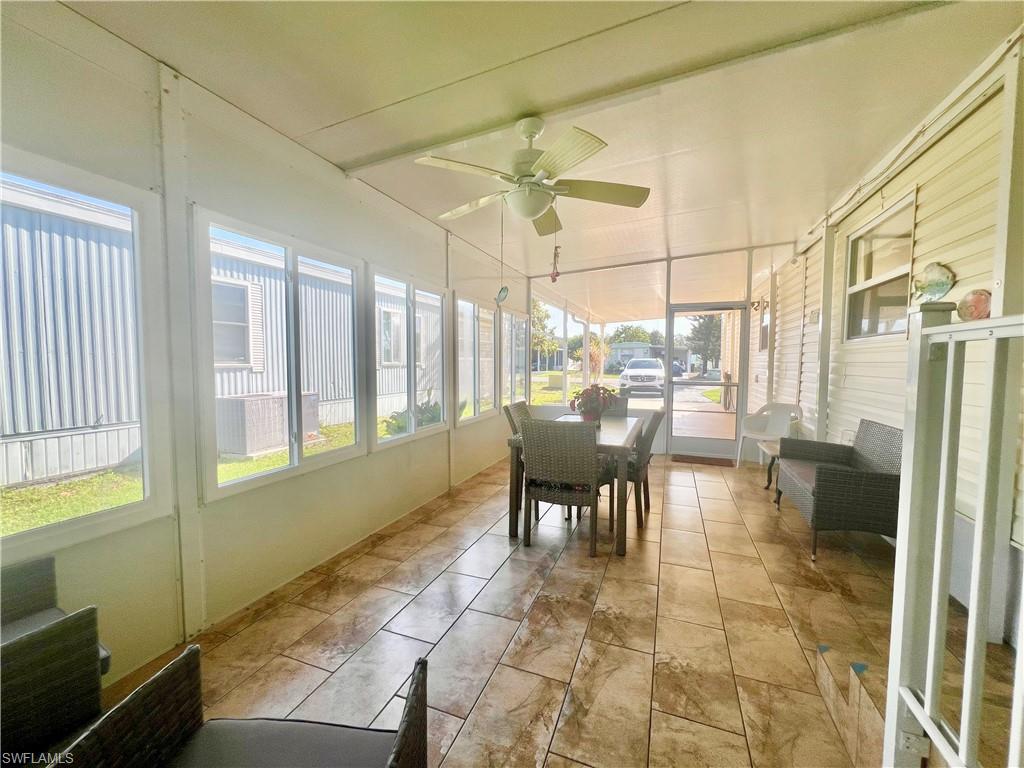 273 Cape Sable Drive Naples, FL 34104 - Photo 28 of 49 a dining room with furniture and a floor to ceiling window